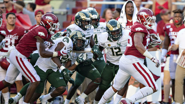 FAYETTEVILLE, AR - SEPTEMBER 14: Cheyenne O"u2019Grady #85 of the Arkansas Razorbacks breaks tackles to run for a touchdown during a game against the Colorado State Rams at Razorback Stadium on September 14, 2019 in Fayetteville, Arkansas. The Razorbacks defeated the Rams 55-34.