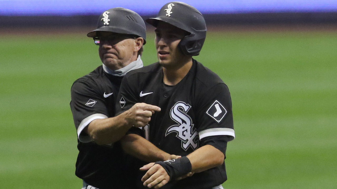 MILWAUKEE, WI - AUGUST 04: Chicago White Sox third base coach Nick Capra calls for a trainer for Chicago White Sox second baseman Nick Madrigal (1) during a game between the Chicago White Sox and the Milwaukee Brewers at Miller Park on August 4, 2020 in Milwaukee, WI.