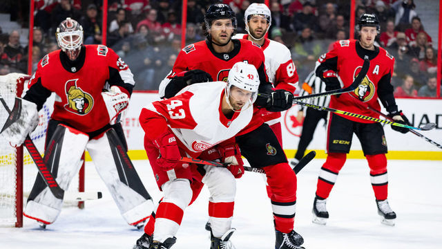 OTTAWA, ON - FEBRUARY 29: Ottawa Senators Defenceman Ron Hainsey (81) battles Detroit Red Wings Left Wing Darren Helm (43) during first period National Hockey League action between the Detroit Red Wings and Ottawa Senators on February 29, 2020, at Canadian Tire Centre in Ottawa, ON, Canada.
