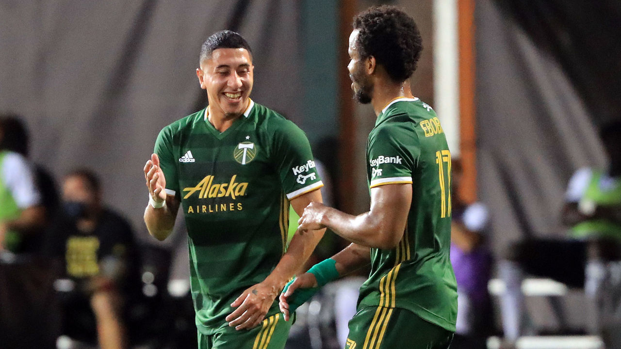 REUNION, FLORIDA - AUGUST 05: Jeremy Ebobisse #17 of Portland Timbers celebrates his first half goal with Marvin Loria #44 against the Philadelphia Union during the MLS Is Back Tournament semifinals at ESPN Wide World of Sports Complex on August 05, 2020 in Reunion, Florida.