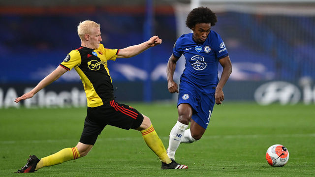LONDON, ENGLAND - JULY 04: Willian of Chelsea is challenged by Will Hughes of Watford during the Premier League match between Chelsea FC and Watford FC at Stamford Bridge on July 04, 2020 in London, England. Football Stadiums around Europe remain empty due to the Coronavirus Pandemic as Government social distancing laws prohibit fans inside venues resulting in all fixtures being played behind closed doors.