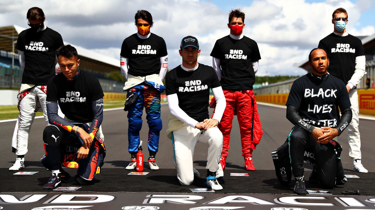 NORTHAMPTON, ENGLAND - AUGUST 02: F1 drivers kneel on the grid in support of the Black Lives Matter movement before the F1 Grand Prix of Great Britain at Silverstone on August 02, 2020 in Northampton, England.