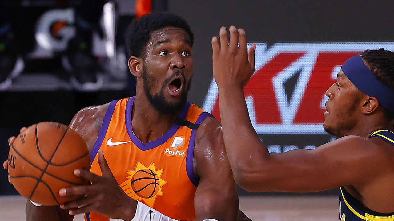 LAKE BUENA VISTA, FLORIDA - AUGUST 06: Deandre Ayton #22 of the Phoenix Suns drives to the basket as Myles Turner #33 of the Indiana Pacers defends at Visa Athletic Center at ESPN Wide World Of Sports Complex on August 06, 2020 in Lake Buena Vista, Florida.