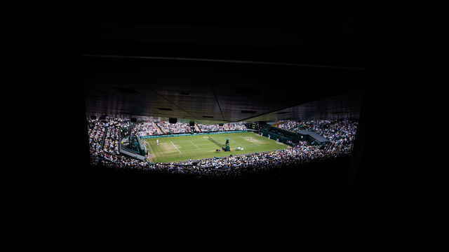 LONDON, ENGLAND - JULY 8: The view from the back of center court during the Men's Fourth Round match between Joao Sousa of Portugal and Rafael Nadal of Spain at The Wimbledon Lawn Tennis Championship at the All England Lawn and Tennis Club at Wimbledon on July 8, 2019 in London, England.