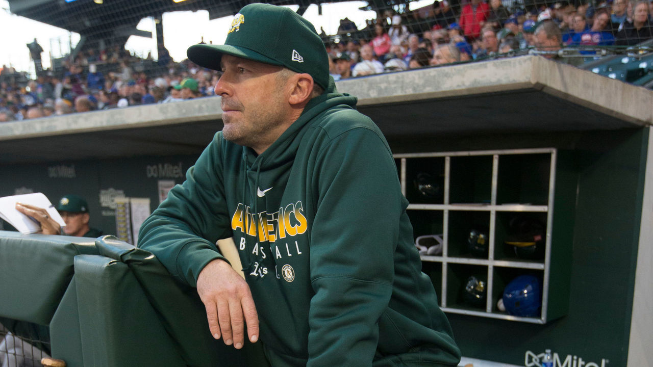 MESA, AZ - February 22: Bench Coach Ryan Christenson #29 of the Oakland Athletics stands in the dugout prior to the game against the Chicago Cubs at Sloan Park on February 22, 2020 in Mesa, Arizona.