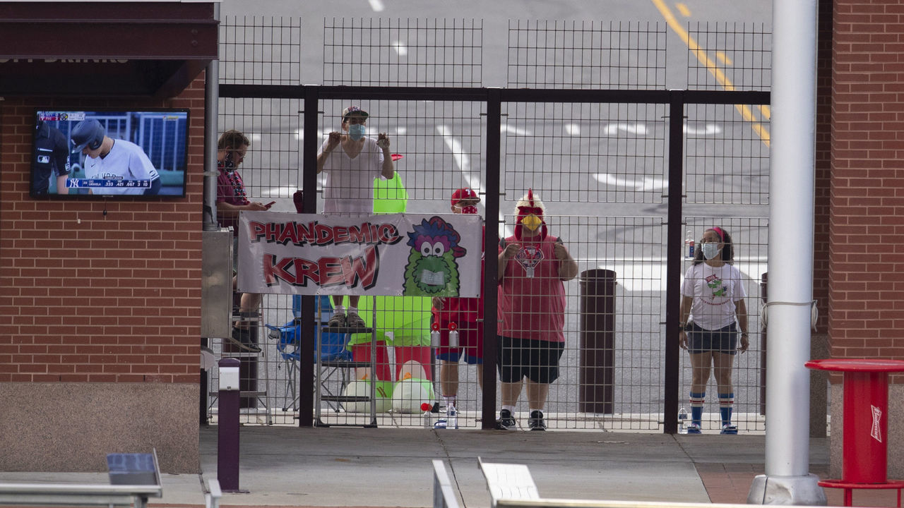 PHILADELPHIA, PA - AUGUST 06: Fans watch the game between the New York Yankees and Philadelphia Phillies from outside of Citizens Bank Park on August 6, 2020 in Philadelphia, Pennsylvania. The Phillies defeated the Yankees 5-4.