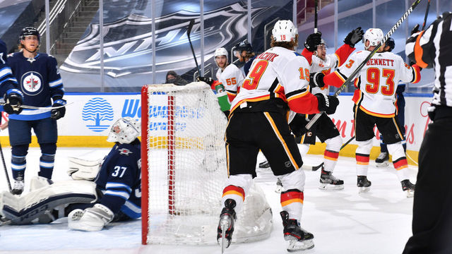EDMONTON, ALBERTA - AUGUST 06: Sam Bennett #93 of the Calgary Flames celebrates his goal on goaltender Connor Hellebuyck #37 of the Winnipeg Jets during the first period of Game Four of the Western Conference Qualification Round at Rogers Place on August 06, 2020 in Edmonton, Alberta.