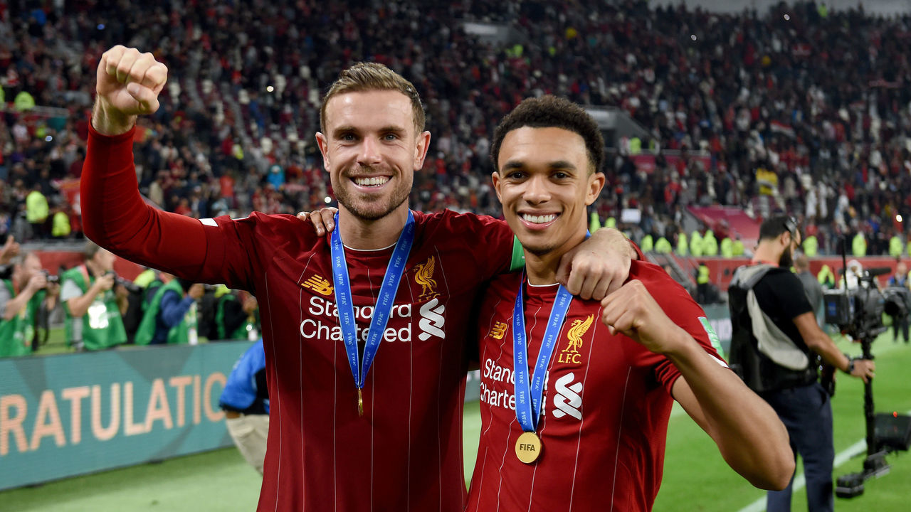 DOHA, QATAR - DECEMBER 21: (THE SUN OUT, THE SUN ON SUNDAY OUT) Jordan Henderson and Trent Alexander-Arnold of Liverpool at the end after winning the FIFA Club World Cup final match between Liverpool FC and CR Flamengo at Khalifa International Stadium on December 21, 2019 in Doha, Qatar.