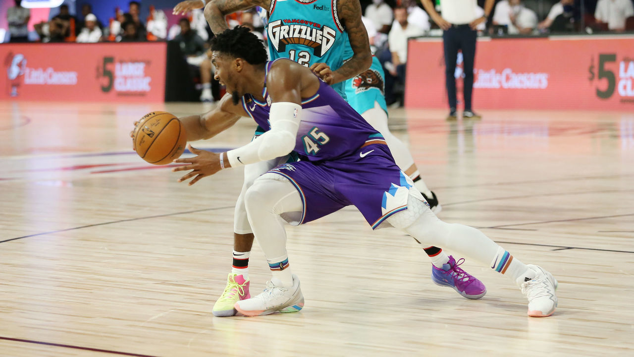 Orlando, FL - AUGUST 5: Ja Morant #12 of the Memphis Grizzlies plays defense on Donovan Mitchell #45 of the Utah Jazz on August 5, 2020 at The Arena at ESPN Wide World of Sports in Orlando, Florida. NOTE TO USER: User expressly acknowledges and agrees that, by downloading and/or using this Photograph, user is consenting to the terms and conditions of the Getty Images License Agreement. Mandatory Copyright Notice: Copyright 2020 NBAE
