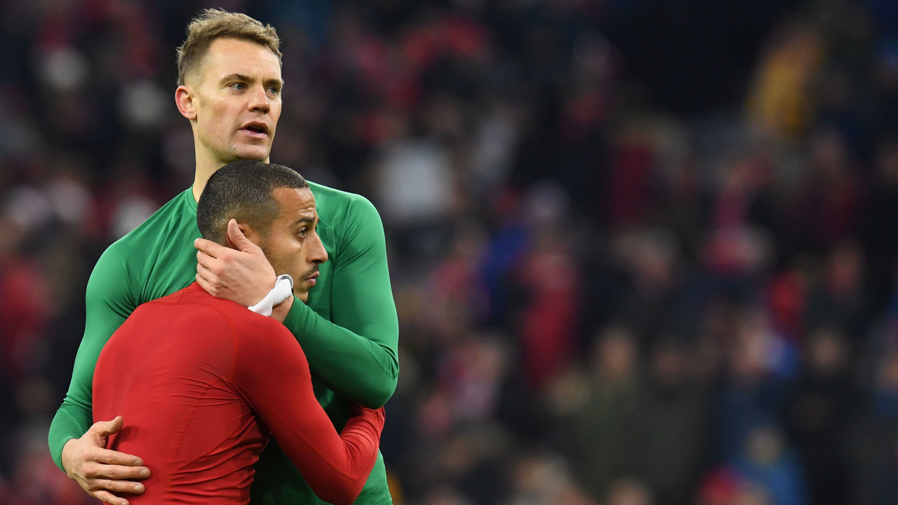 Bayern Munich's goalkeeper Manuel Neuer (L) and Bayern Munich's Spanish midfielder Thiago Alcantara (R) react after the German first division Bundesliga football match FC Bayern Munich vs Bayer 04 Leverkusen in Munich, southern Germany, on November 30, 2019.