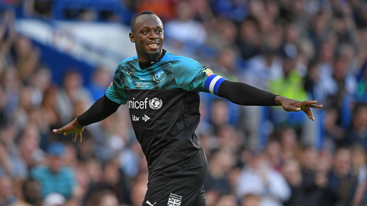LONDON, ENGLAND - JUNE 16: Usain Bolt celebrates scoring The rest of the worlds first goal during the Soccer Aid for UNICEF 2019 - England v Soccer Aid World XI at Stamford Bridge on June 26th, 2019 in London, England.