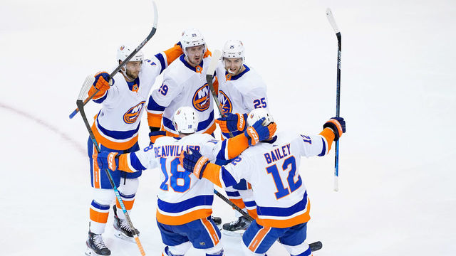 TORONTO, ONTARIO - AUGUST 07: Brock Nelson #29 of the New York Islanders is congratulated by teammates Derick Brassard #10,Devon Toews #25,Josh Bailey #12 and Anthony Beauvillier #18 after Nelson scored in the second period against the Florida Panthers in Game Four of the Eastern Conference Qualification Round prior to the 2020 NHL Stanley Cup Playoffs at Scotiabank Arena on August 07, 2020 in Toronto, Ontario.