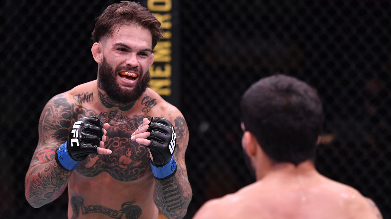 LAS VEGAS, NEVADA - JUNE 06: (L-R) Cody Garbrandt battles Raphael Assuncao of Brazil in their bantamweight bout during the UFC 250 event at UFC APEX on June 06, 2020 in Las Vegas, Nevada.