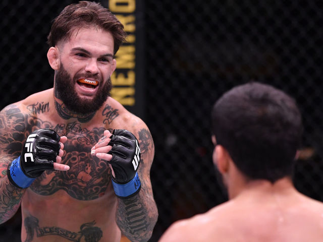 LAS VEGAS, NEVADA - JUNE 06: (L-R) Cody Garbrandt battles Raphael Assuncao of Brazil in their bantamweight bout during the UFC 250 event at UFC APEX on June 06, 2020 in Las Vegas, Nevada.