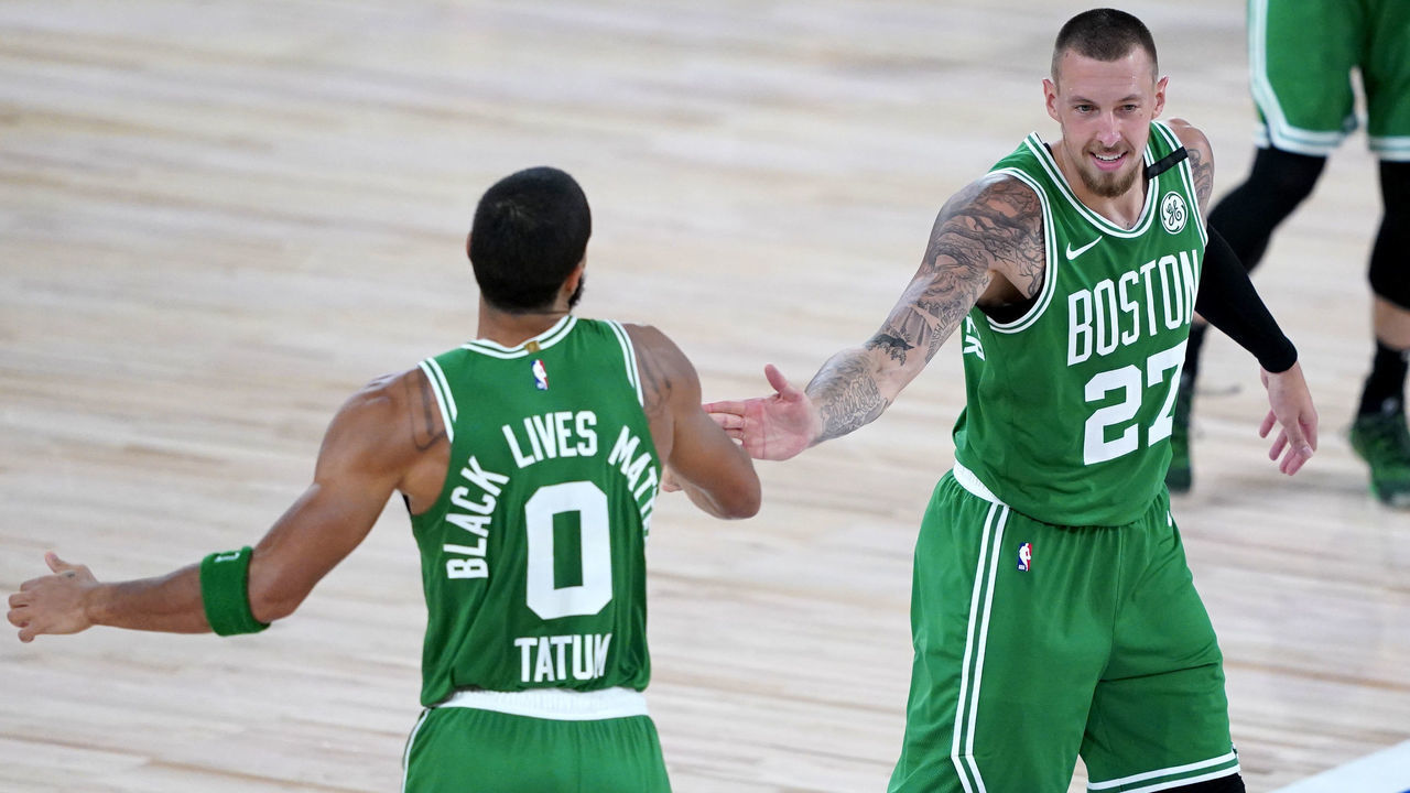 LAKE BUENA VISTA, FLORIDA - AUGUST 07: Jayson Tatum #0 of the Boston Celtics celebrates his three-pointer with Daniel Theis #27 of the Boston Celtics during the second half of an NBA basketball game against the Toronto Raptors at the ESPN Wide World Of Sports Complex on August 7, 2020 in Lake Buena Vista, Florida.