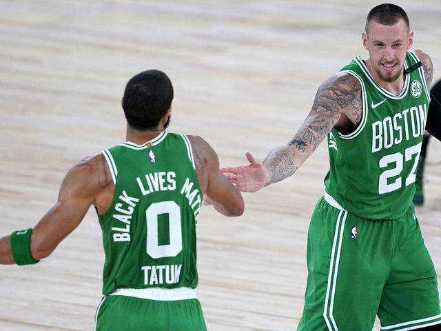 LAKE BUENA VISTA, FLORIDA - AUGUST 07: Jayson Tatum #0 of the Boston Celtics celebrates his three-pointer with Daniel Theis #27 of the Boston Celtics during the second half of an NBA basketball game against the Toronto Raptors at the ESPN Wide World Of Sports Complex on August 7, 2020 in Lake Buena Vista, Florida.
