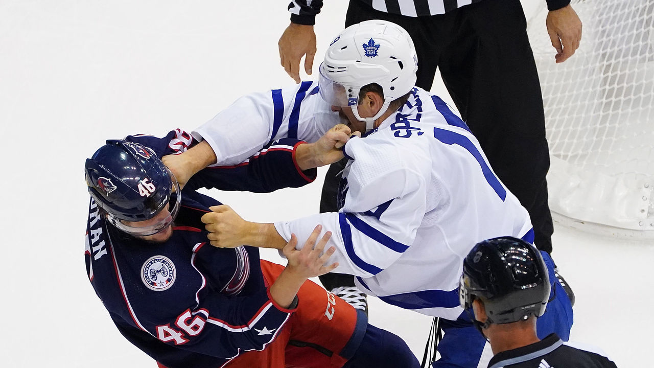 TORONTO, ONTARIO - AUGUST 07: Jason Spezza #19 of the Toronto Maple Leafs and Dean Kukan #46 of the Columbus Blue Jackets fight in Game Four of the Eastern Conference Qualification Round prior to the 2020 NHL Stanley Cup Playoffs at Scotiabank Arena on August 07, 2020 in Toronto, Ontario.