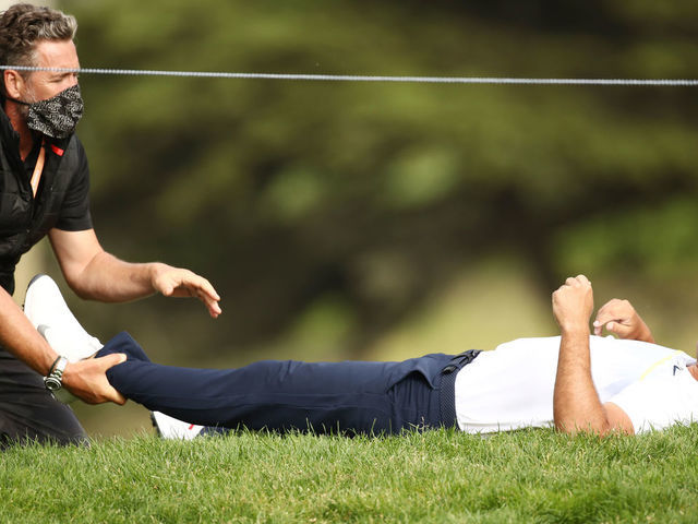 SAN FRANCISCO, CALIFORNIA - AUGUST 07: Brooks Koepka of the United States stretches out on the 12th hole during the second round of the 2020 PGA Championship at TPC Harding Park on August 07, 2020 in San Francisco, California.