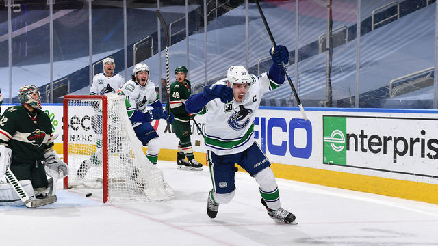 EDMONTON, ALBERTA - AUGUST 07: Bo Horvat #53 of the Vancouver Canucks reacts after scoring against goaltender Alex Stalock #32 of the Minnesota Wild in the third period of Game Four of the Western Conference Qualification Round at Rogers Place on August 07, 2020 in Edmonton, Alberta.