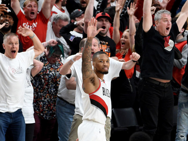 Damian Lillard of the Portland Trail Blazers waves over to the News  Photo - Getty Images