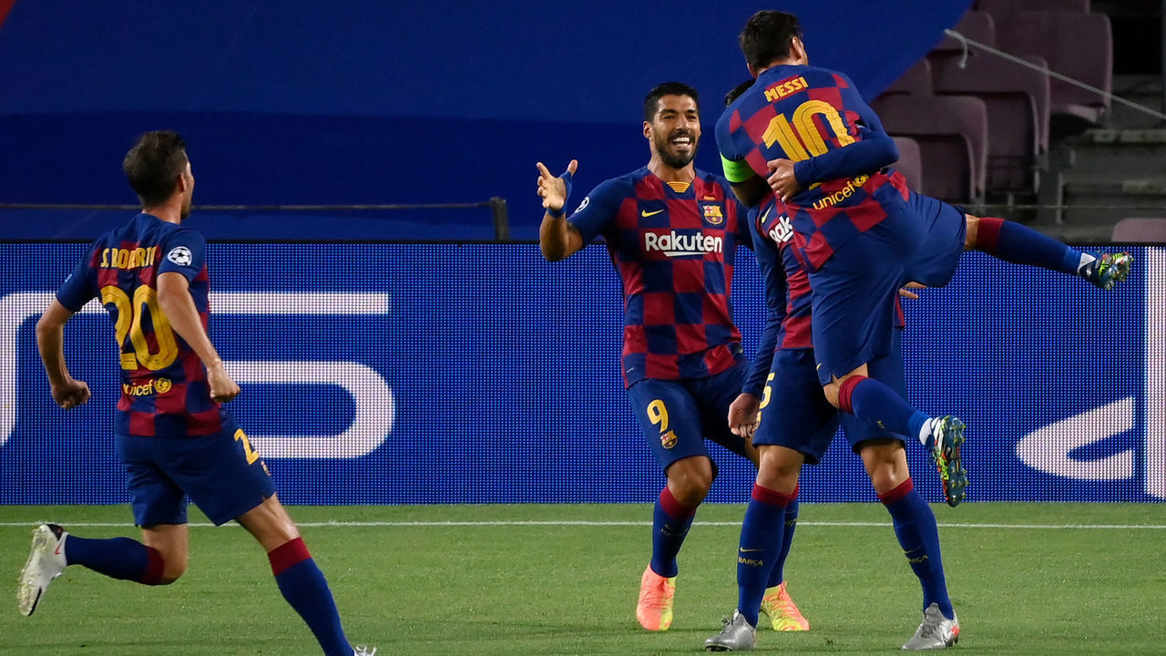 Barcelona's French defender Clement Lenglet (C) celebrates with Barcelona's Argentine forward Lionel Messi (R), Barcelona's Uruguayan forward Luis Suarez (2nd R) and Barcelona's Spanish defender Sergi Roberto (R) after scoring a goal during the UEFA Champions League round of 16 second leg football match between FC Barcelona and Napoli at the Camp Nou stadium in Barcelona on August 8, 2020.