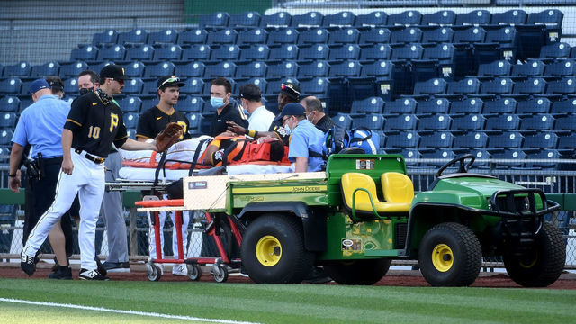 PITTSBURGH, PA - AUGUST 08: Phillip Evans #64 of the Pittsburgh Pirates is helped off the field by paramedics after a collision with teammate Gregory Polanco #25 in the sixth inning during the game against the Detroit Tigers at PNC Park on August 8, 2020 in Pittsburgh, Pennsylvania.
