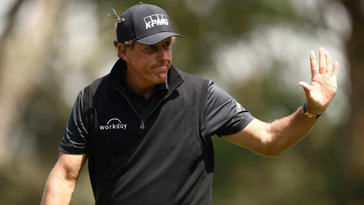 SAN FRANCISCO, CALIFORNIA - AUGUST 08: Phil Mickelson of the United States waves to fans outside a fence near the 12th hole during the third round of the 2020 PGA Championship at TPC Harding Park on August 08, 2020 in San Francisco, California.