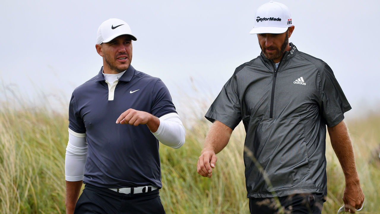 PORTRUSH, NORTHERN IRELAND - JULY 17: Brooks Koepka and Dustin Johnson of the United States look on during a practice round prior to the 148th Open Championship held on the Dunluce Links at Royal Portrush Golf Club on July 17, 2019 in Portrush, United Kingdom.