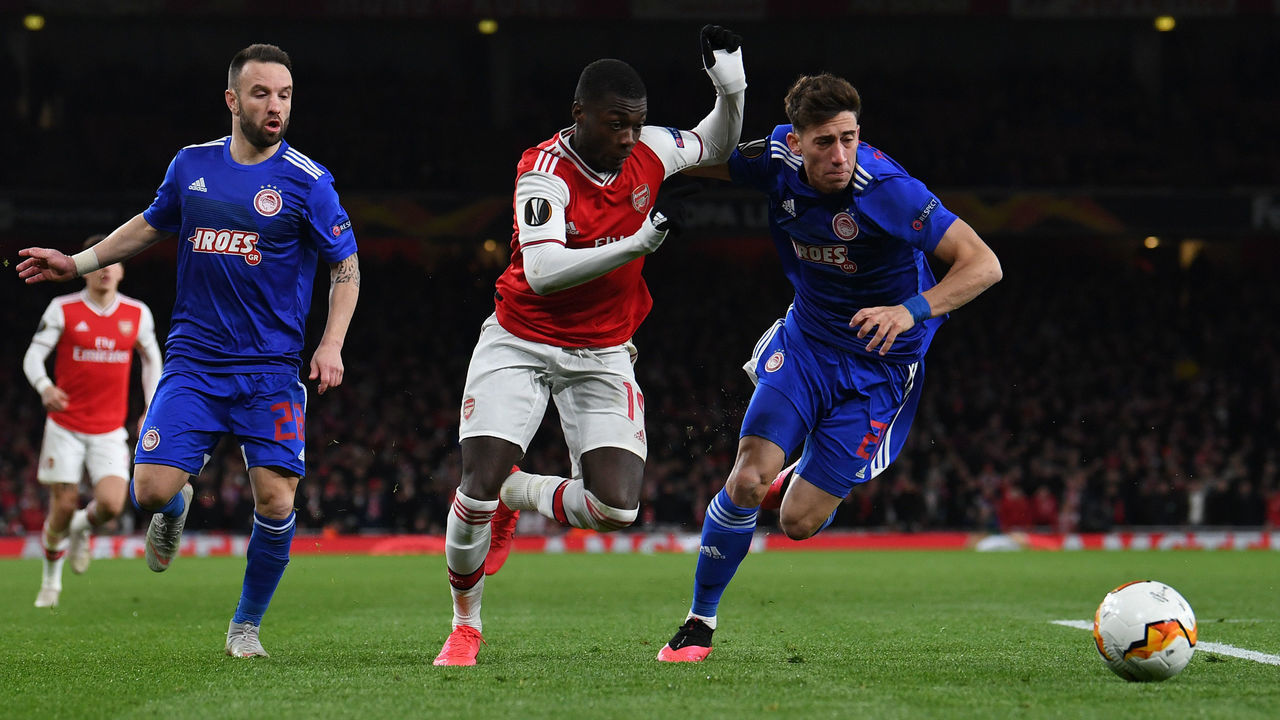 LONDON, ENGLAND - FEBRUARY 27: Nicolas Pepe of Arsenal takes on Kostas Tsimikas of Olympiacos during the UEFA Europa League round of 32 second leg match between Arsenal FC and Olympiacos FC at Emirates Stadium on February 27, 2020 in London, United Kingdom.
