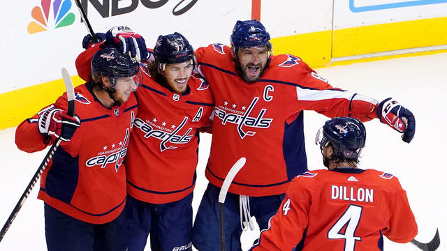 TORONTO, ONTARIO - AUGUST 09: T.J. Oshie #77 of the Washington Capitals celebrates with his teammates after scoring a goal on Tuukka Rask #40 of the Boston Bruins during the first period in an Eastern Conference Round Robin game during the 2020 NHL Stanley Cup Playoffs at Scotiabank Arena on August 09, 2020 in Toronto, Ontario, Canada.
