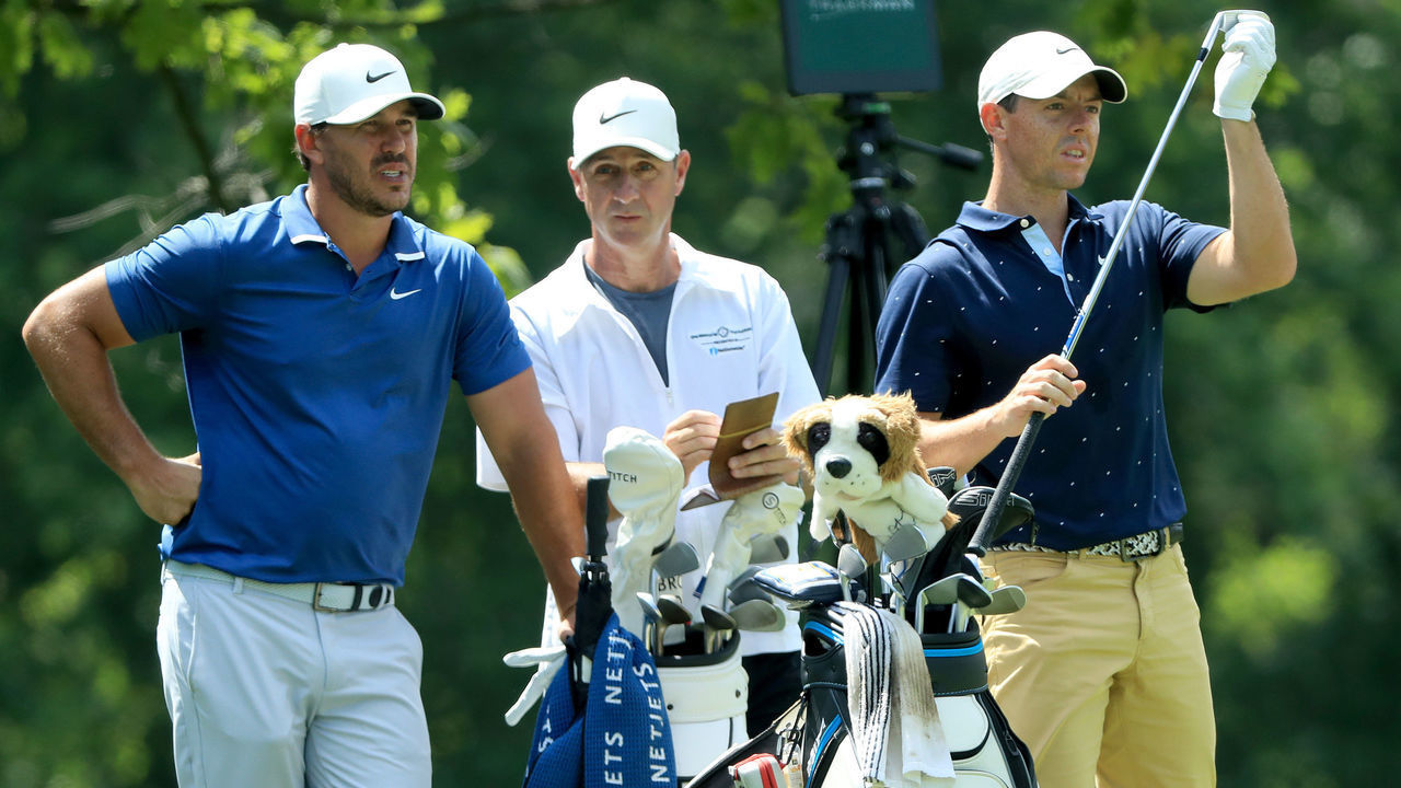 DUBLIN, OHIO - JULY 17: Brooks Koepka of the United States, caddie Ricky Elliott, and Rory McIlroy of Northern Ireland look on during the second round of The Memorial Tournament on July 17, 2020 at Muirfield Village Golf Club in Dublin, Ohio.