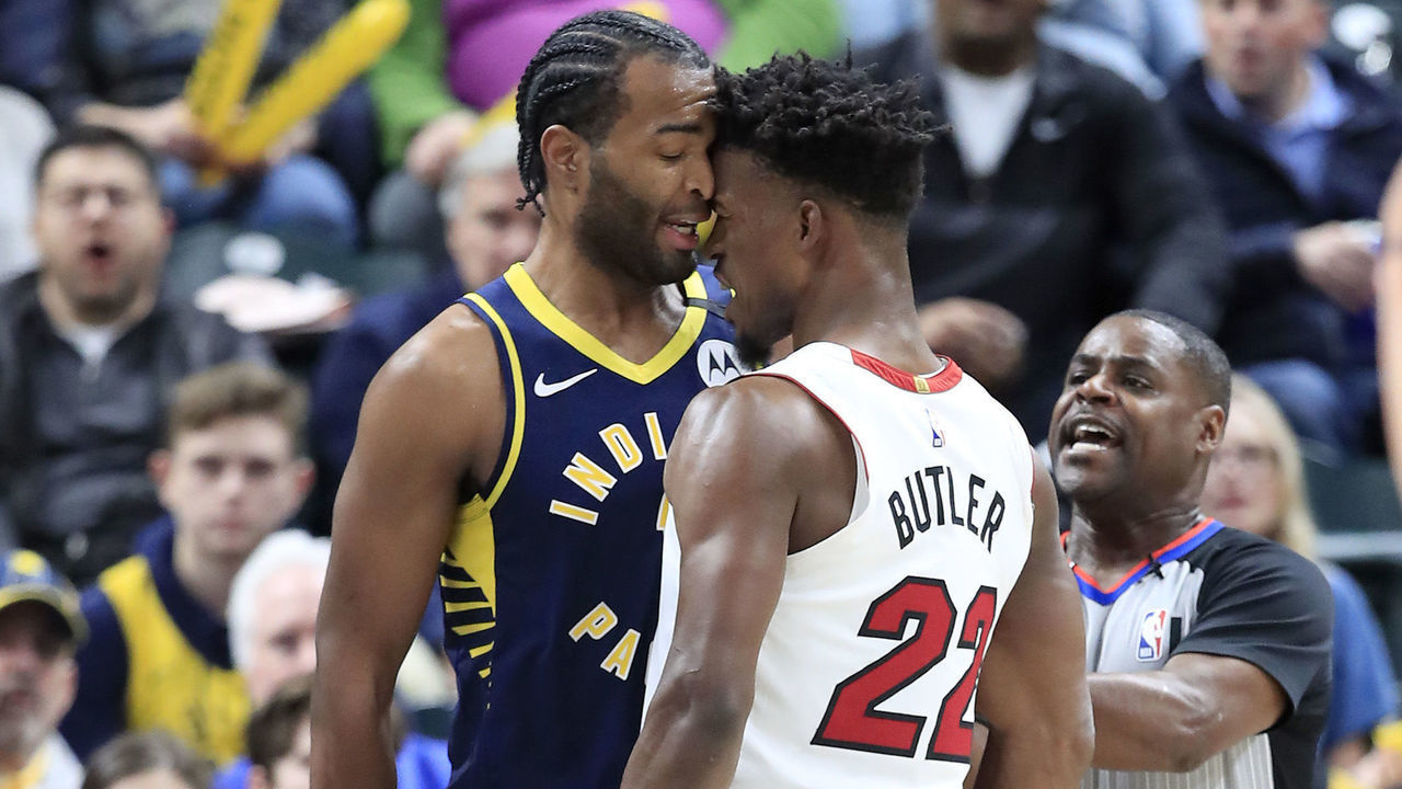 INDIANAPOLIS, INDIANA - JANUARY 08: Jimmy Butler #22 of the Miami Heat and T.J. Warren #1 of the Indiana Pacers get involved in an argument during the game at Bankers Life Fieldhouse on January 08, 2020 in Indianapolis, Indiana.