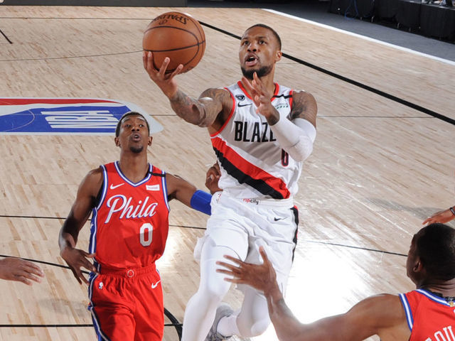 Orlando, FL - AUGUST 9: Damian Lillard #0 of the Portland Trail Blazers shoots the ball against the Philadelphia 76ers on August 9, 2020 at Visa Athletic Center at ESPN Wide World of Sports in Orlando, Florida. NOTE TO USER: User expressly acknowledges and agrees that, by downloading and/or using this Photograph, user is consenting to the terms and conditions of the Getty Images License Agreement. Mandatory Copyright Notice: Copyright 2020 NBAE