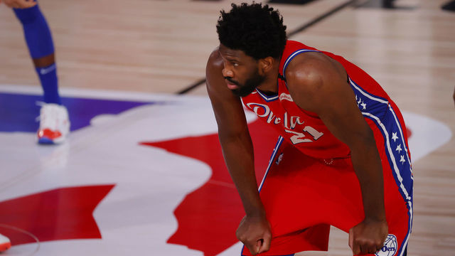 LAKE BUENA VISTA, FLORIDA - AUGUST 09: Joel Embiid #21 of the Philadelphia 76ers looks on against the Portland Trail Blazers at Visa Athletic Center at ESPN Wide World Of Sports Complex on August 09, 2020 in Lake Buena Vista, Florida.
