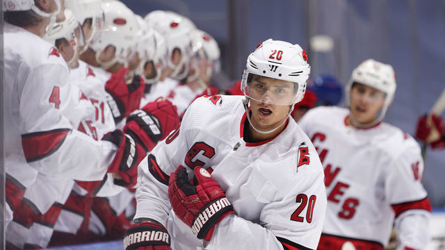 TORONTO, ONTARIO - AUGUST 04: Sebastian Aho #20 of the Carolina Hurricanes celebrates with teammates on the bench Aho scored against the New York Rangers in the third period of Game Three of the Eastern Conference Qualification Round prior to the 2020 NHL Stanley Cup Playoffs at Scotiabank Arena on August 04, 2020 in Toronto, Ontario.