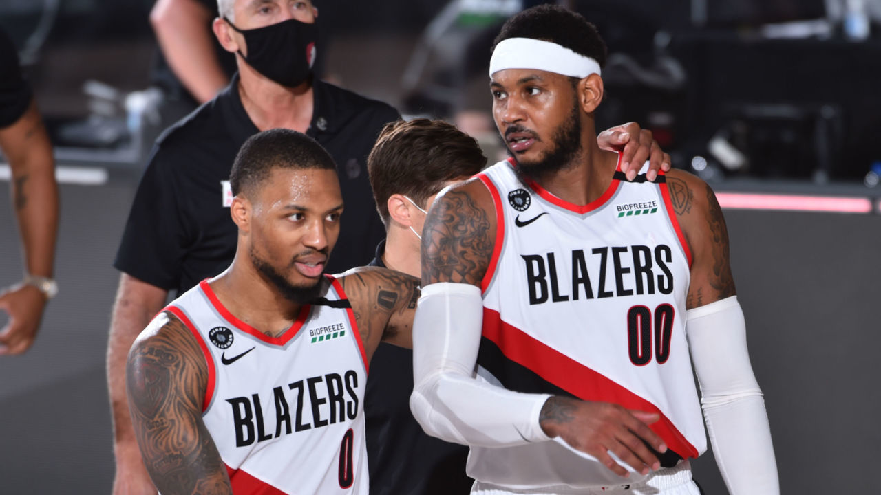 Orlando, FL - AUGUST 9: Damian Lillard #0 of the Portland Trail Blazers and Carmelo Anthony #00 of the Portland Trail Blazers talk after a game against the Philadelphia 76ers on August 9, 2020 at Visa Athletic Center at ESPN Wide World of Sports in Orlando, Florida. NOTE TO USER: User expressly acknowledges and agrees that, by downloading and/or using this Photograph, user is consenting to the terms and conditions of the Getty Images License Agreement. Mandatory Copyright Notice: Copyright 2020 NBAE