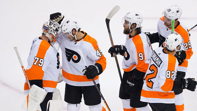 TORONTO, ONTARIO - AUGUST 08: Carter Hart #79 of the Philadelphia Flyers, Connor Bunnaman #82 of the Philadelphia Flyers, Ivan Provorov #9 of the Philadelphia Flyers and Joel Farabee #49 of the Philadelphia Flyers along with teammates celebrate their win over Tampa Bay Lightning in an Eastern Conference Round Robin game during the 2020 NHL Stanley Cup Playoff at Scotiabank Arena on August 08, 2020 in Toronto, Ontario, Canada.