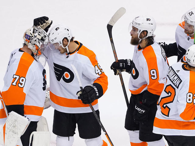 TORONTO, ONTARIO - AUGUST 08: Carter Hart #79 of the Philadelphia Flyers, Connor Bunnaman #82 of the Philadelphia Flyers, Ivan Provorov #9 of the Philadelphia Flyers and Joel Farabee #49 of the Philadelphia Flyers along with teammates celebrate their win over Tampa Bay Lightning in an Eastern Conference Round Robin game during the 2020 NHL Stanley Cup Playoff at Scotiabank Arena on August 08, 2020 in Toronto, Ontario, Canada.