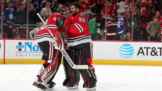 CHICAGO, IL - NOVEMBER 10: Goalies Robin Lehner #40 and Corey Crawford #50 of the Chicago Blackhawks celebrate after defeating the Toronto Maple Leafs 5-4 at the United Center on November 10, 2019 in Chicago, Illinois.
