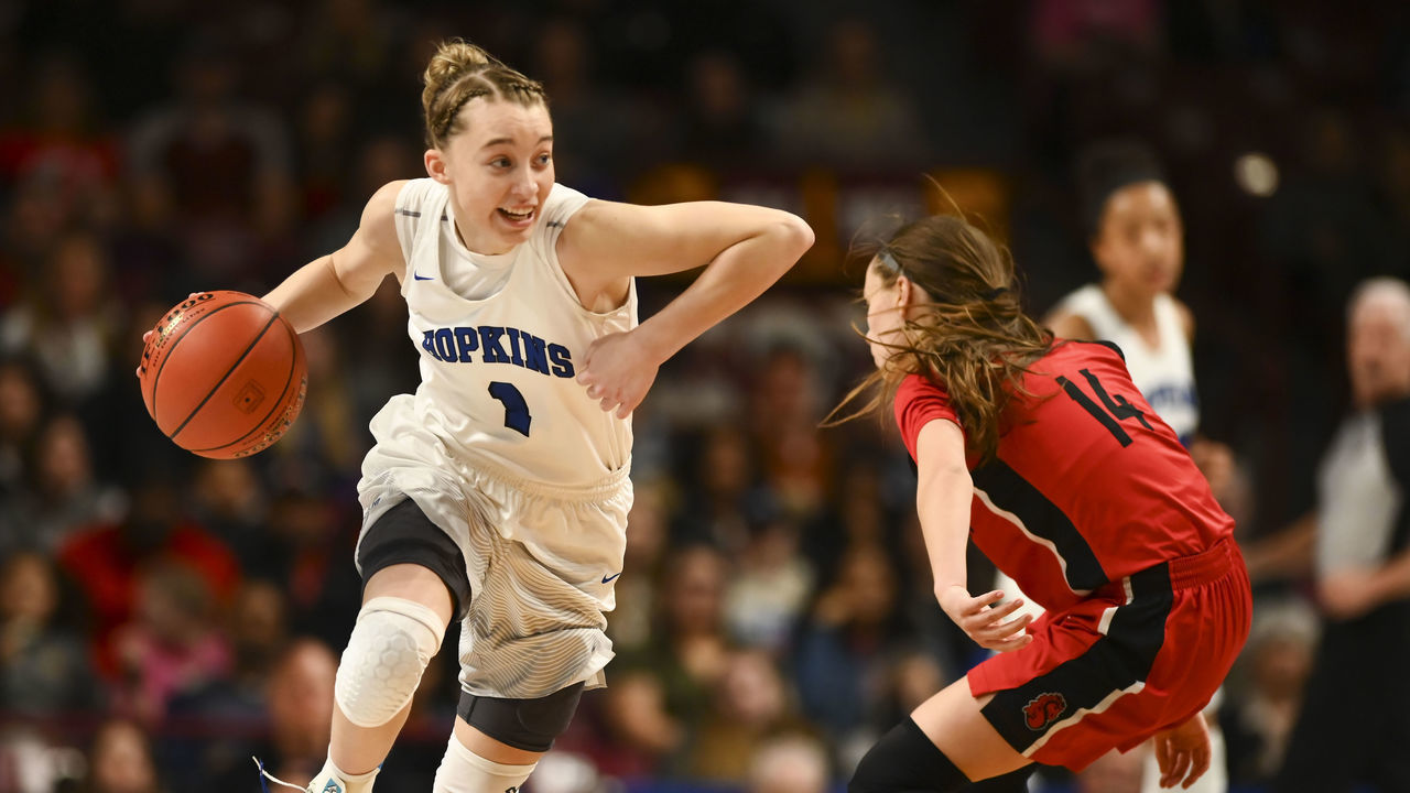 Minneapolis, MN March 16: Hopkins guard Paige Bueckers (1) was defended by Stillwater guard Sara Scalia (14) in the second half.