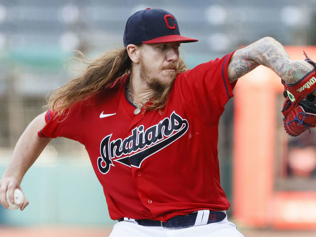 CLEVELAND, OH - AUGUST 05: Starting pitcher Mike Clevinger #52 of the Cleveland Indians pitches against the Cincinnati Reds during the first inning at Progressive Field on August 05, 2020 in Cleveland, Ohio.