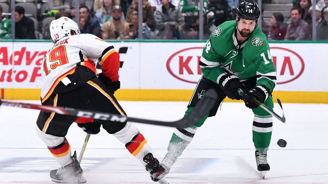 DALLAS, TX - DECEMBER 22: Jamie Benn #14 of the Dallas Stars handles the puck against the Calgary Flames at the American Airlines Center on December 22, 2019 in Dallas, Texas.