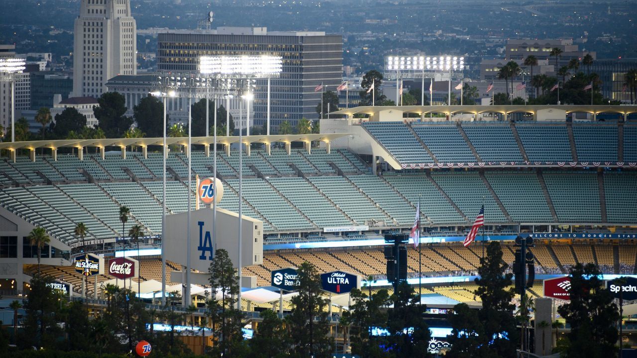 A view of empty seats in Dodgers Stadium as the Los Angeles Dodgers play the San Francisco Giants in an empty stadium on the opening day of the coronavirus-abbreviated Major League Baseball (MLB) season, July 23, 2020 in Los Angeles. - The game is being played without fans in the stadium due to the COVID-19 pandemic.