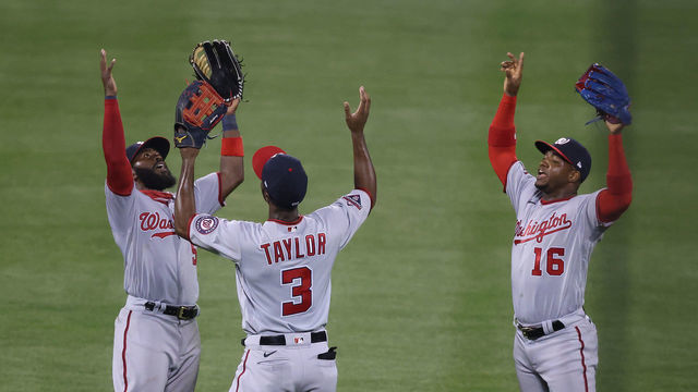 NEW YORK, NEW YORK - AUGUST 10: Josh Harrison #5, Michael A. Taylor #3, and Victor Robles #16 of the Washington Nationals their 16-4 win against the New York Mets during their game at Citi Field on August 10, 2020 in New York City.