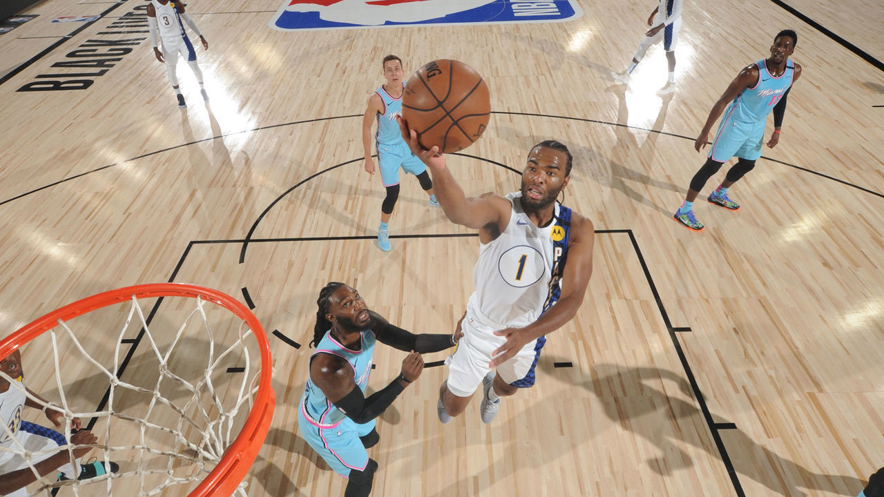 Orlando, FL - AUGUST 10: T.J. Warren #1 of the Indiana Pacers drives to the basket against the Miami Heat on August 10, 2020 at Visa Athletic Center at ESPN Wide World of Sports in Orlando, Florida. NOTE TO USER: User expressly acknowledges and agrees that, by downloading and/or using this Photograph, user is consenting to the terms and conditions of the Getty Images License Agreement. Mandatory Copyright Notice: Copyright 2020 NBAE