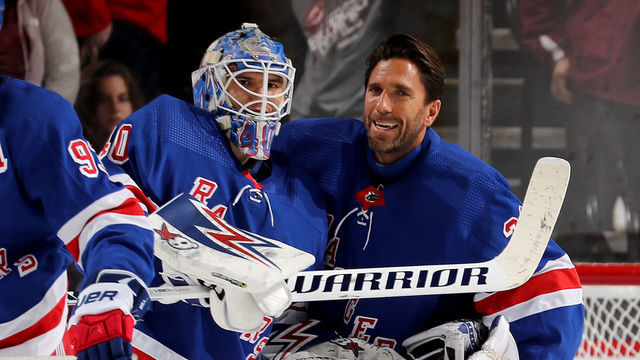 NEWARK, NEW JERSEY - NOVEMBER 30: Alexandar Georgiev #40 of the New York Rangers is congratulated by teammate Henrik Lundqvist #30 of the New York Rangers after the win over the New Jersey Devils at Prudential Center on November 30, 2019 in Newark, New Jersey.The New York Rangers defeated the New Jersey Devils 4-0.