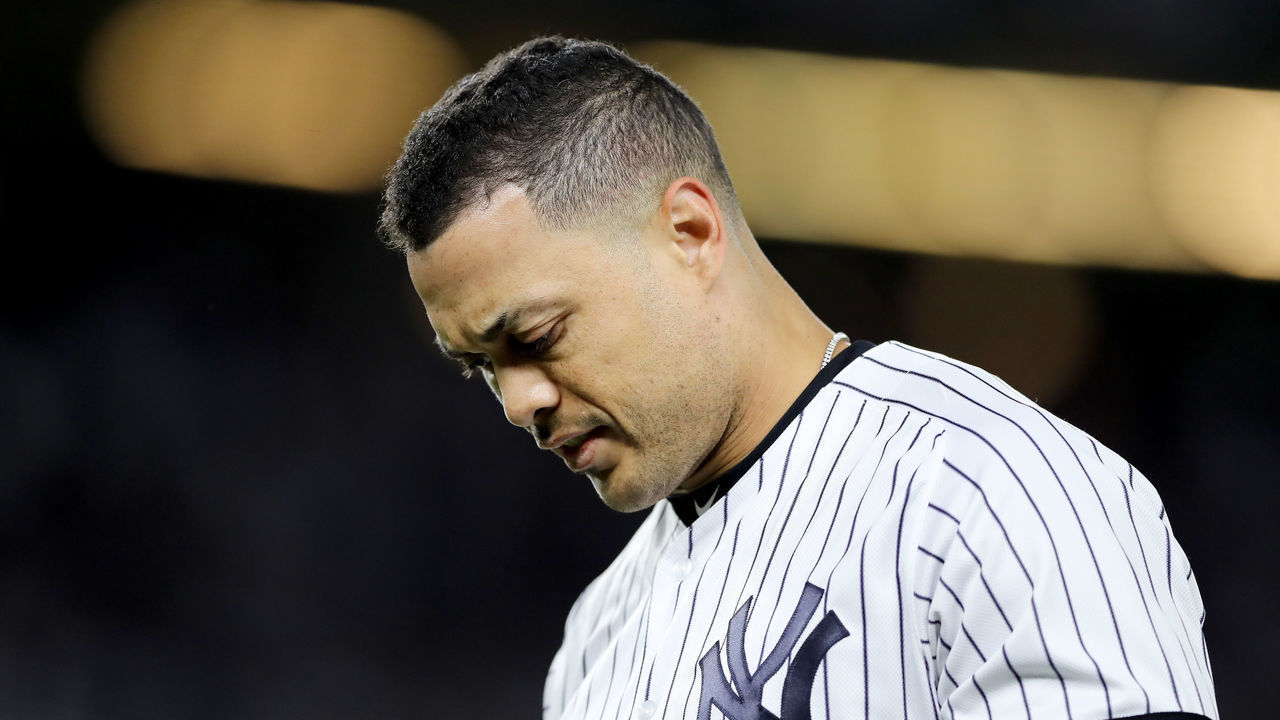 NEW YORK, NEW YORK - OCTOBER 04: Giancarlo Stanton #27 of the New York Yankees reacts after grounding out against the Minnesota Twins during the first inning in game one of the American League Division Series at Yankee Stadium on October 04, 2019 in New York City.