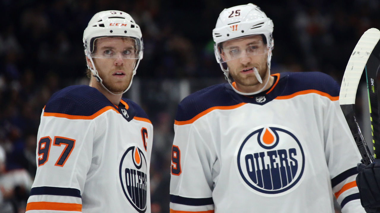 NEW YORK, NEW YORK - OCTOBER 08: Connor McDavid #97 and Leon Draisaitl #29 of the Edmonton Oilers prepare to skate against the New York Islanders at NYCB's LIVE Nassau Coliseum on October 08, 2019 in Uniondale, New York.