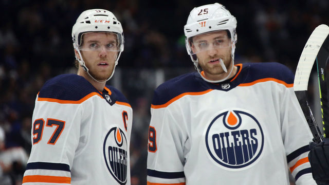 NEW YORK, NEW YORK - OCTOBER 08: Connor McDavid #97 and Leon Draisaitl #29 of the Edmonton Oilers prepare to skate against the New York Islanders at NYCB's LIVE Nassau Coliseum on October 08, 2019 in Uniondale, New York.