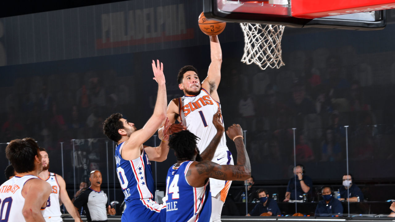Orlando, FL - AUGUST 11: Devin Booker #1 of the Phoenix Suns dunks the ball against the Philadelphia 76ers on August 11, 2020 at Visa Athletic Center at ESPN Wide World of Sports in Orlando, Florida. NOTE TO USER: User expressly acknowledges and agrees that, by downloading and/or using this Photograph, user is consenting to the terms and conditions of the Getty Images License Agreement. Mandatory Copyright Notice: Copyright 2020 NBAE
